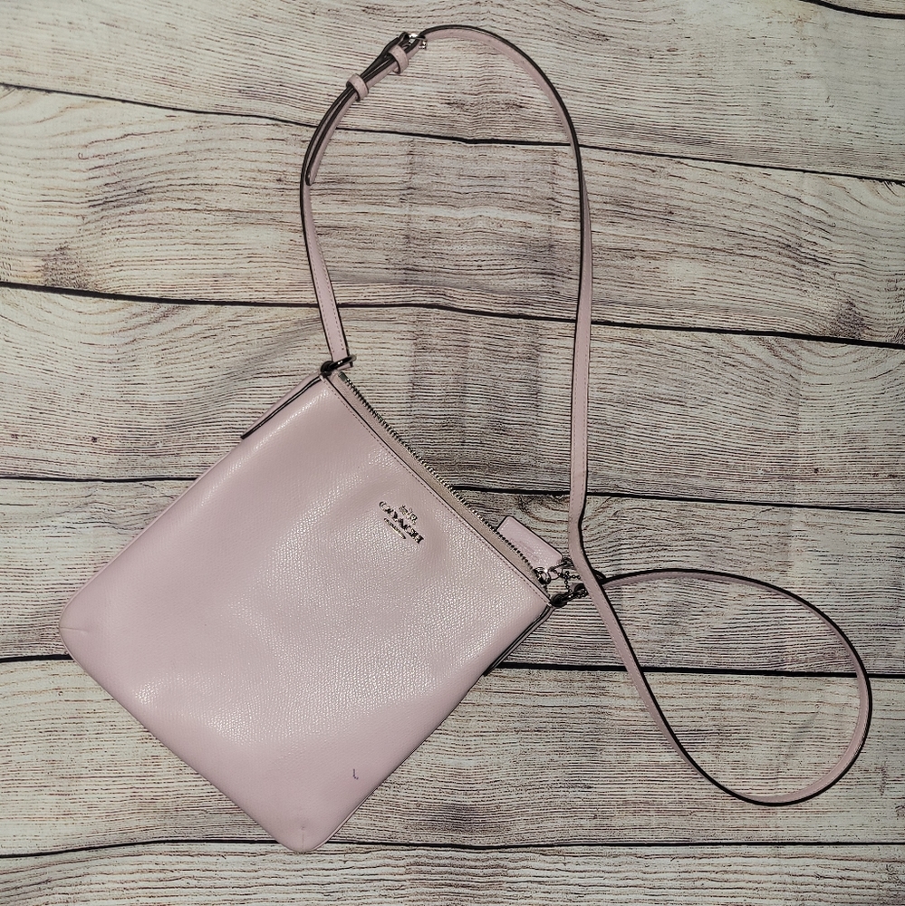 Coach light pink crossbody.